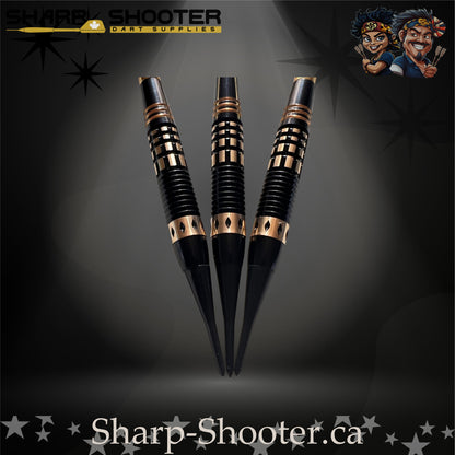 Assassin soft-tip dart set featuring black-and-gold flights, golden flight protectors, black knurled grip barrels, and black soft-tip points — Sharpshooter Exclusive Series.
