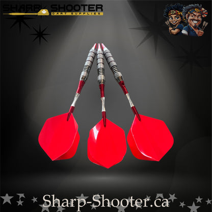 Cherry Bomb soft-tip dart set with red flights, red shafts, and a ringed metallic barrel on a dark spotlight background