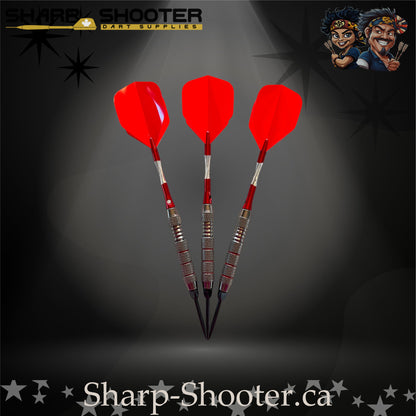Cherry Bomb steel-tip dart set with bright red flights, red shafts, and a textured metallic barrel showcased on a dark star-pattern background.