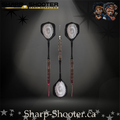 London Fog steel tip dart set featuring silver-grey patterned flights, black shafts, and precision-cut ringed barrels on a dark spotlight background.