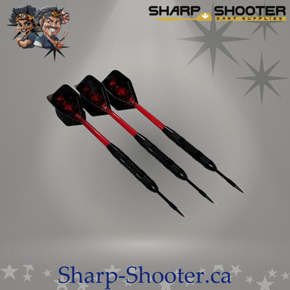 Red Baron steel dart set with straight black barrels, red sparkle flights, and plastic shafts on grey studio background