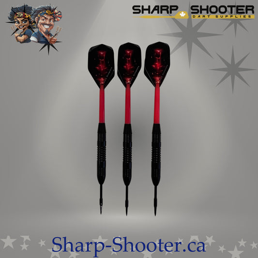 Red Baron steel dart set with straight black barrels, red sparkle flights, and plastic shafts on grey studio background