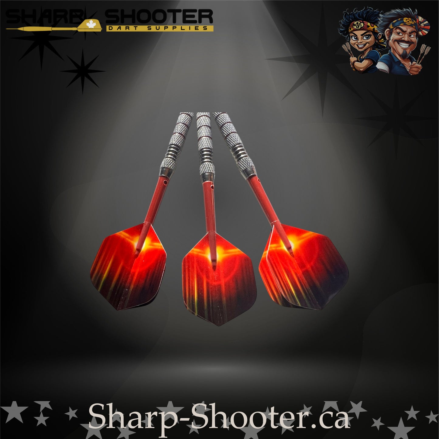 Sunset soft-tip dart set featuring red gradient flights, red shafts, silver ringed barrels, and black soft tips on a dark spotlight background.