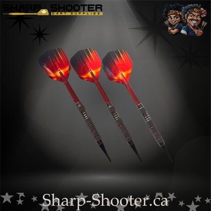 Sunset soft-tip dart set featuring red gradient flights, red shafts, silver ringed barrels, and black soft tips on a dark spotlight background.