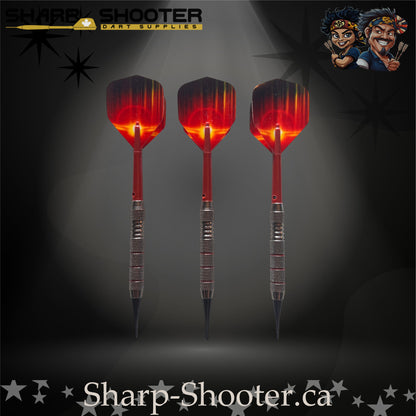 Sunset soft-tip dart set featuring red gradient flights, red shafts, silver ringed barrels, and black soft tips on a dark spotlight background.