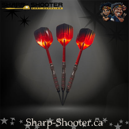 Sunset steel-tip dart set with red gradient flights, red shafts, and silver ringed barrels on a dark spotlight background.