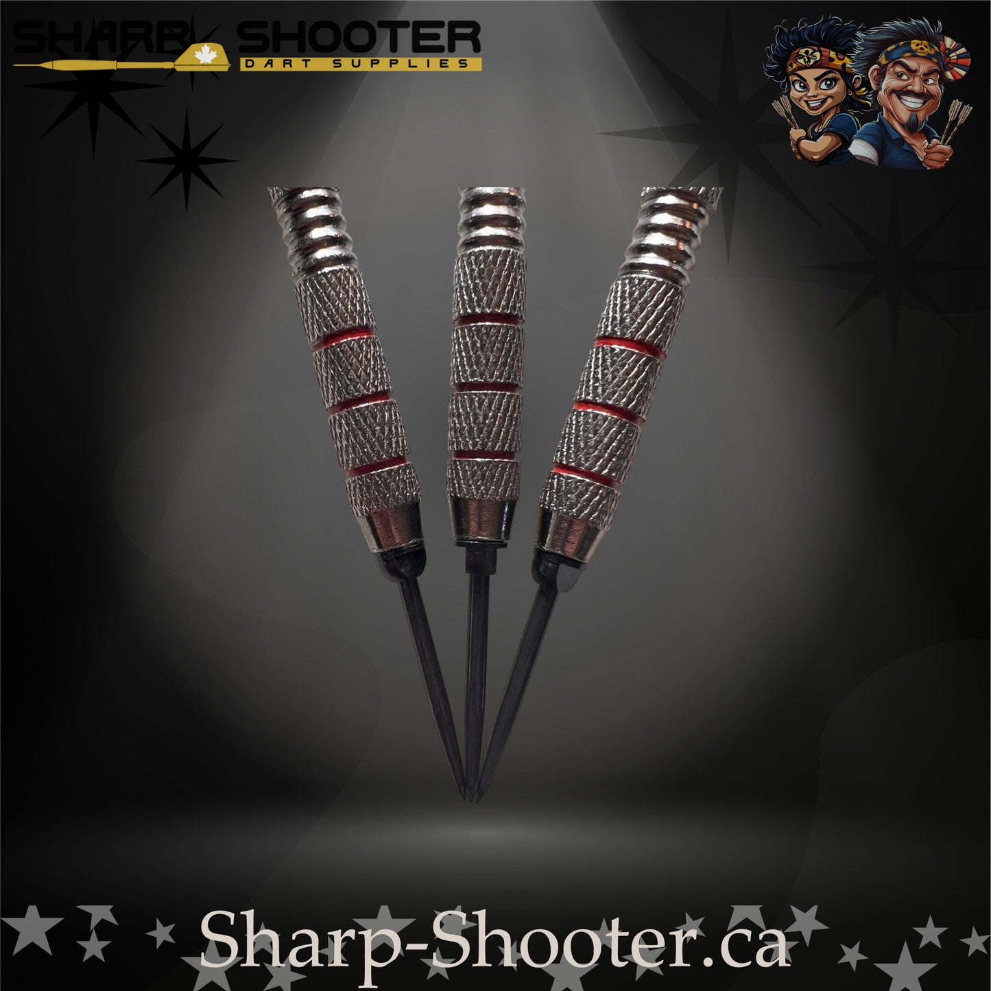 Sunset steel-tip dart set with red gradient flights, red shafts, and silver ringed barrels on a dark spotlight background.